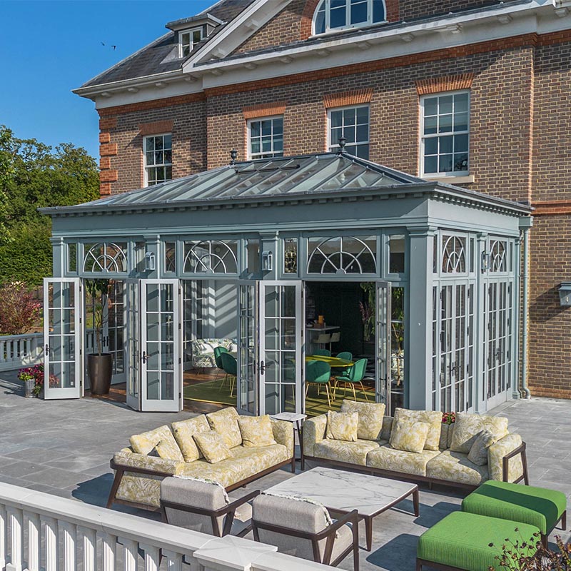 Large orangery with clerestory and decorative fanlights