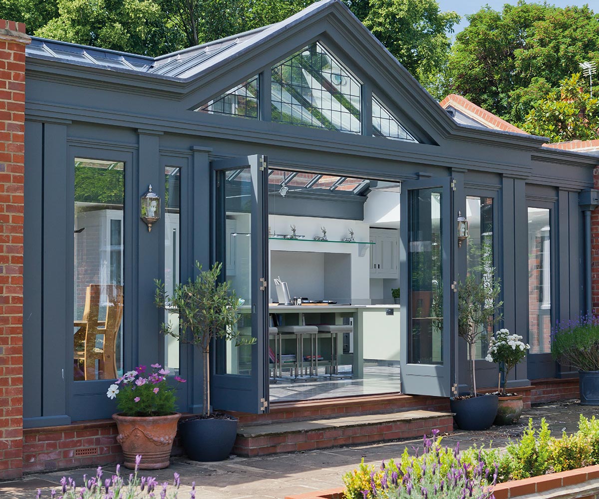 Bifold doors opening from a kitchen conservatory