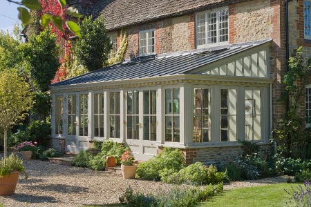 Traditional lean-to provides a simple yet stylish solution to this country home