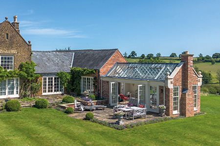 This expansive orangery is a welcome addition to a beautiful countryside property