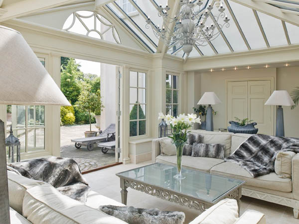 Conservatory sitting room with bright interior design