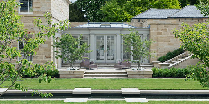 Orangery linking two buildings with views to the garden