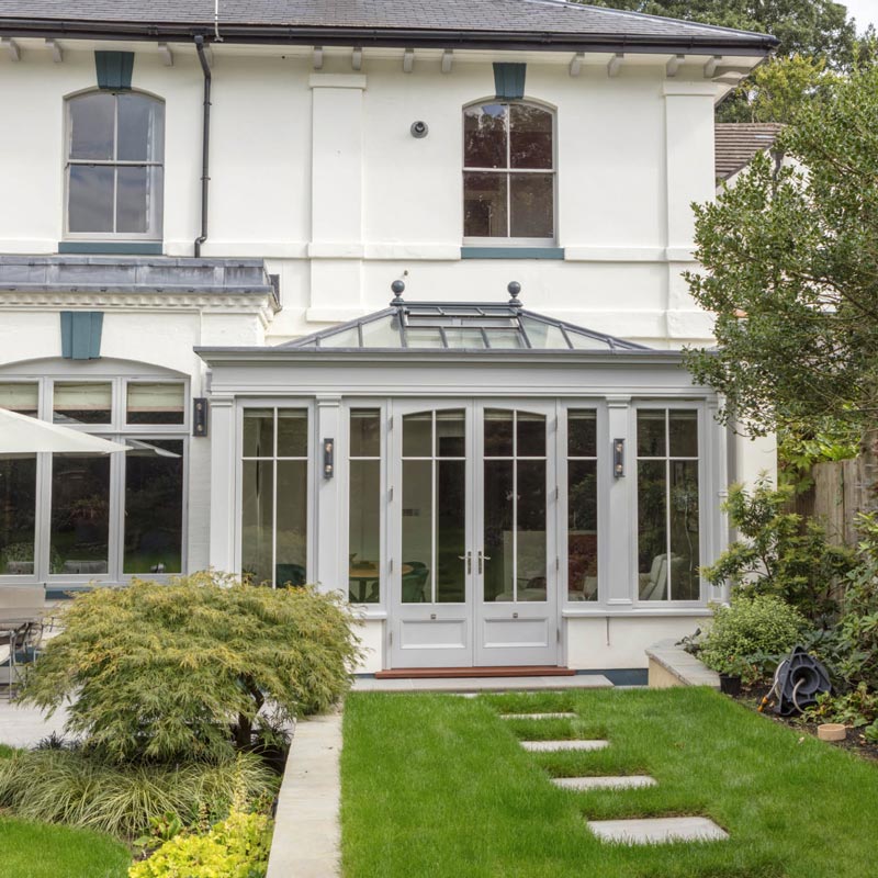 orangery design with a pair of curved headed doors