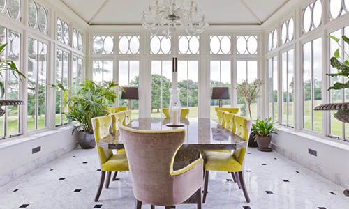 Orangery dining room with a solid roof