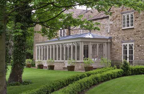 Conservatory With Gothic Arched Window Design.