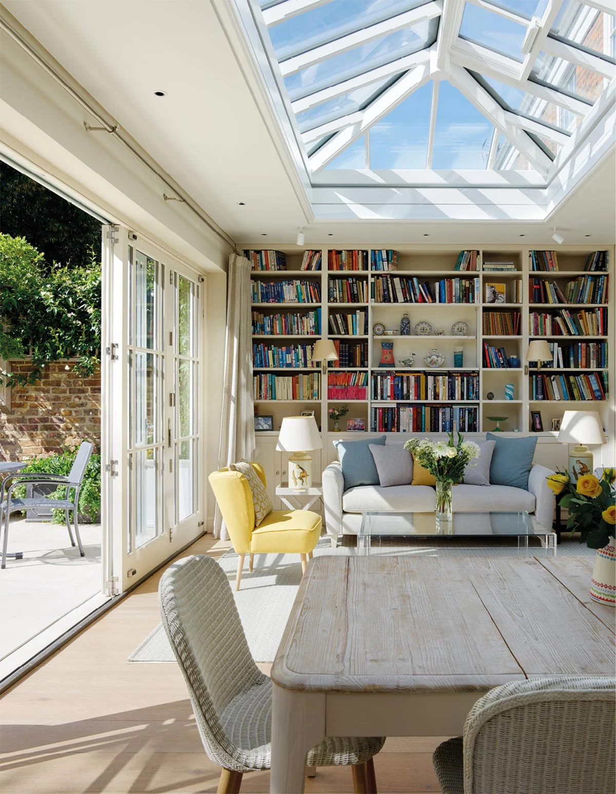 light filled orangery with bookcase